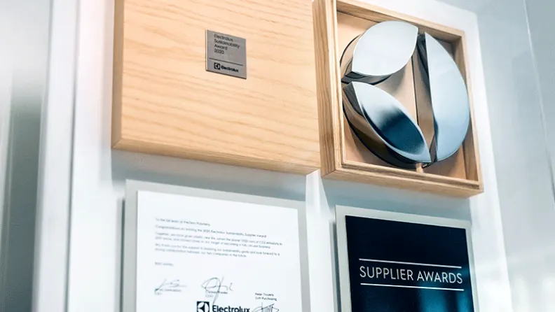 Success Stories supplyer awards hanging on wall