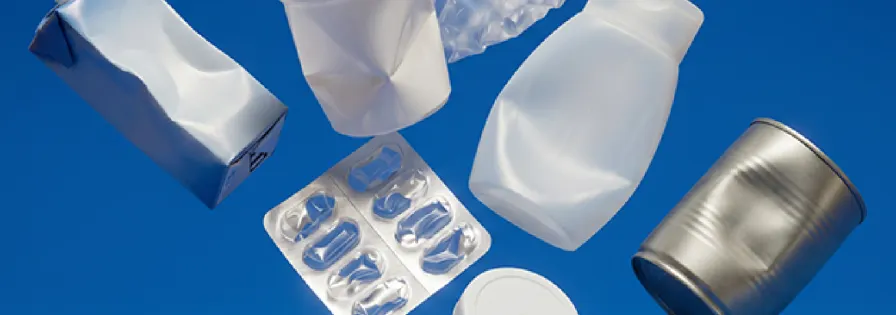 Selection of consumer packaging including beverage cartons, plastic tubs, and cans for PreZero's recyclability assessment