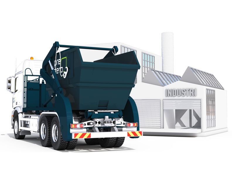 Bil som levererar en liftdumper utanför en industribyggnad