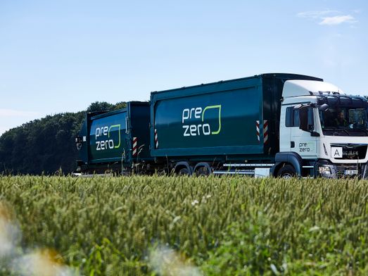 PreZero truck drive next to field