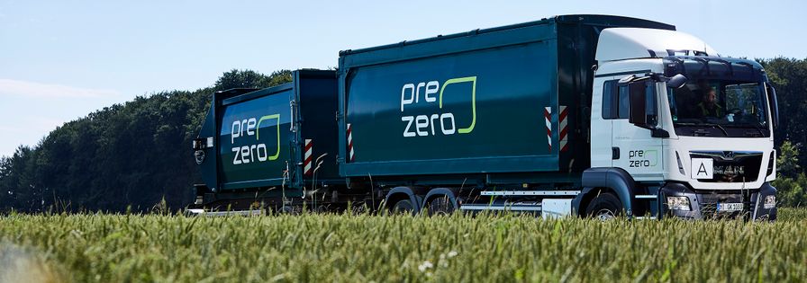 PreZero truck drive next to field