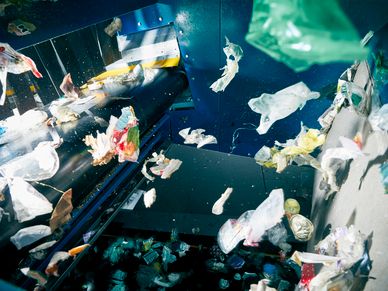 Colorful lastic waste flies onto sorting belt