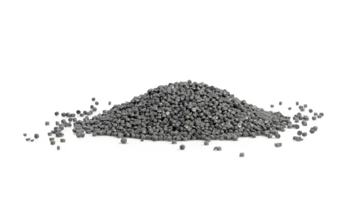 Pile of gray plastic granules on a white background